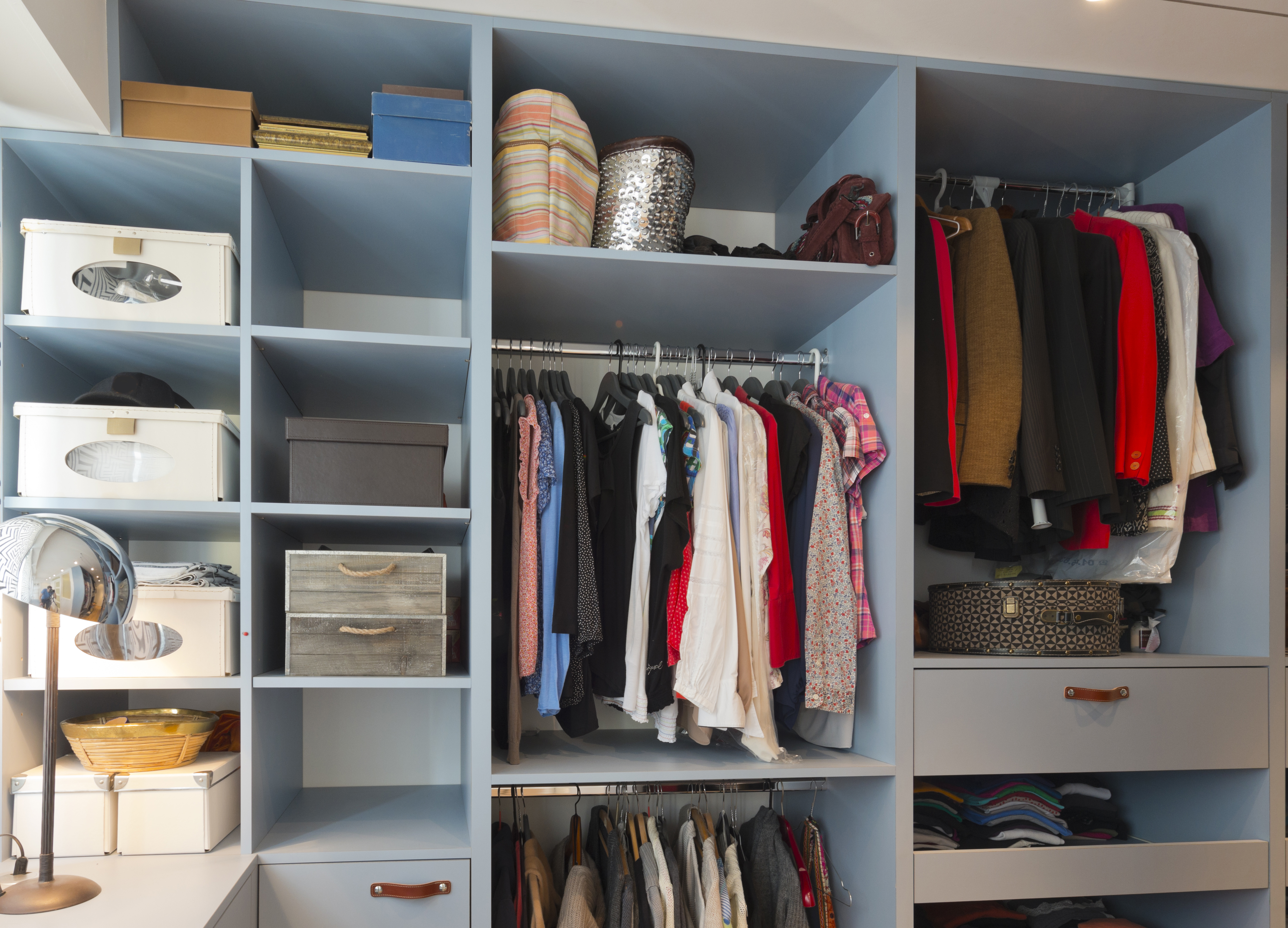 Organized blue walk-in closet